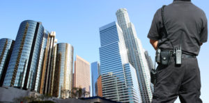 An officer overlooks skyscrapers.