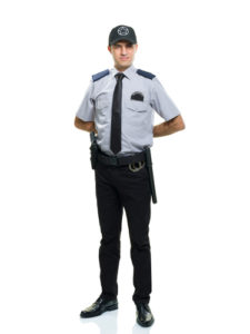 A typical security guard stands at attention.