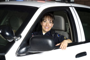 Security officer smiles in car