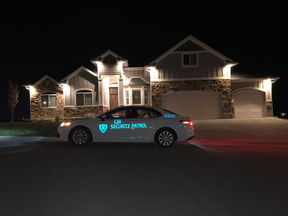 CBI mobile patrol car in front of residence at night